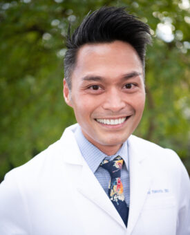 Dr. Romney Piamonte, NYC Dentist, Standing in Central Park